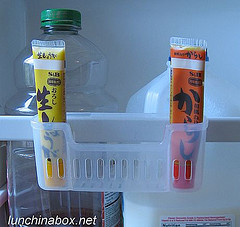 Organized mustard tubes on fridge door