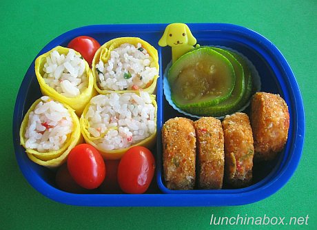 Egg-wrapped onigiri lunch for preschooler