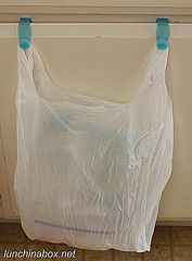 Plastic bag on over-cabinet hooks
