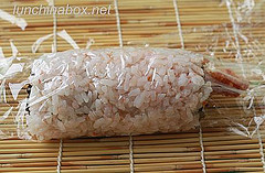 Fried shrimp sushi roll after rolling
